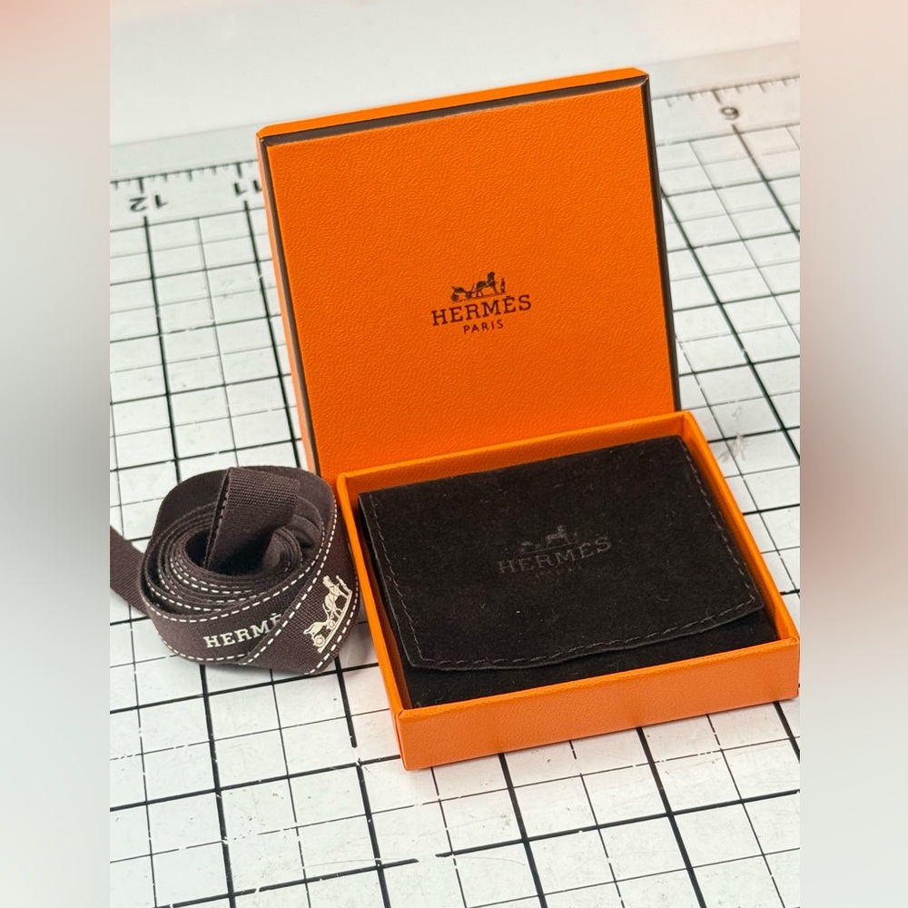 Hermes Orange and Black Storage Box. 3 by 3 inches, ribbon, brown pouch. - Picture 6 of 7